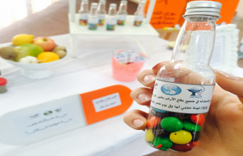 College of Pharmacy female students involved in the activity of the International Day of Pharmacist