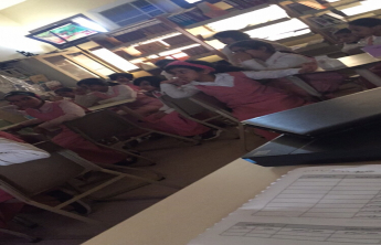 Female students conduct an activity (We made the night as a covering)