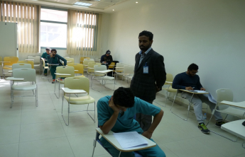 Dean of the College inspects the ongoing examinations